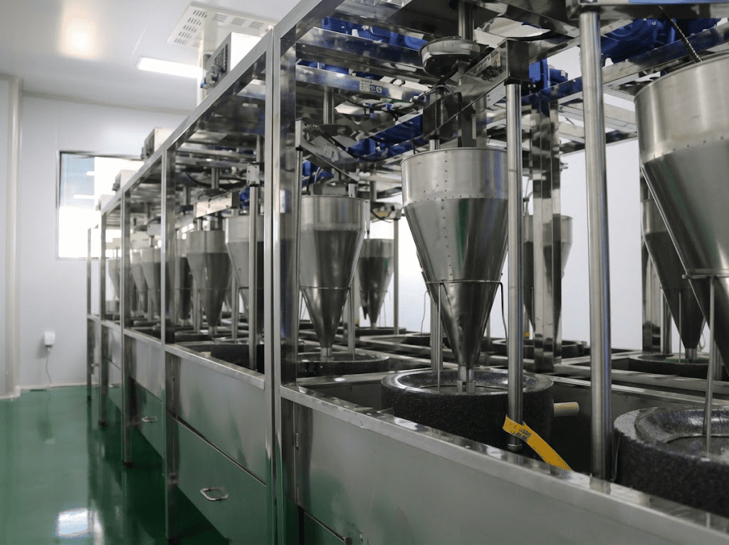matcha processing production line with industrial machinery in factory