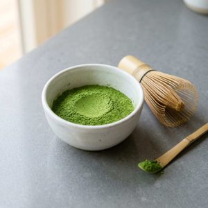 Ceremonial grade matcha powder with vibrant green color and fine texture for premium tea and beverage applications