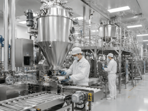 industrial instant tea production line with workers